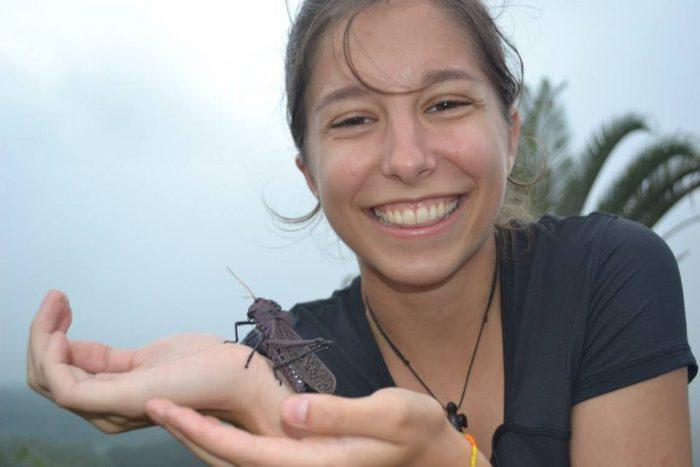 Lindsey Ferguson holding insect during study abroad
