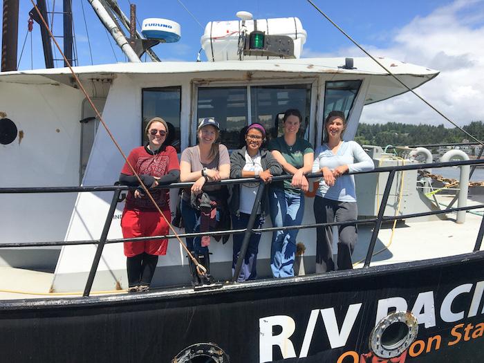 Sarah Henkel, Abigail Losli, and team on their boat