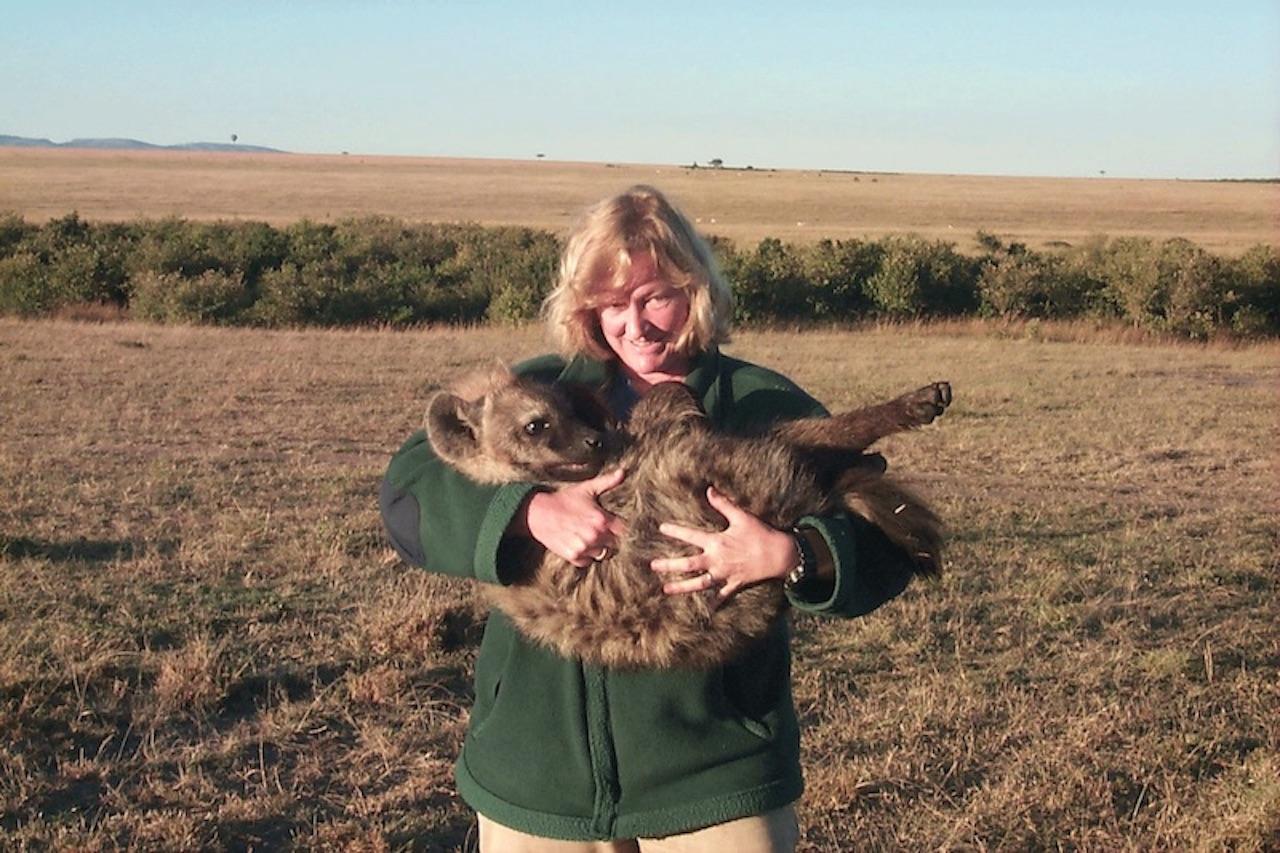 Kay Holekamp holding a cub.
