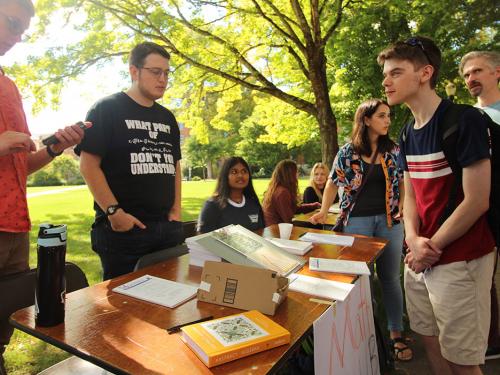 Students tabling a science club booth during the Fall Welcome Social event 2019.