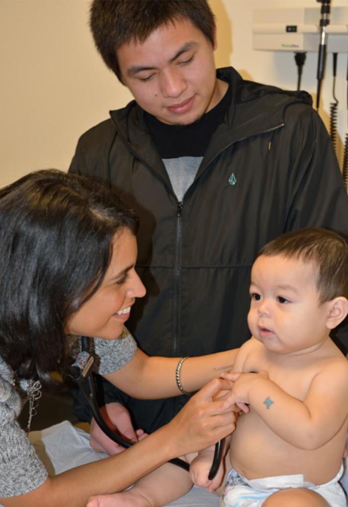 Eva Galvez working with infant patient.