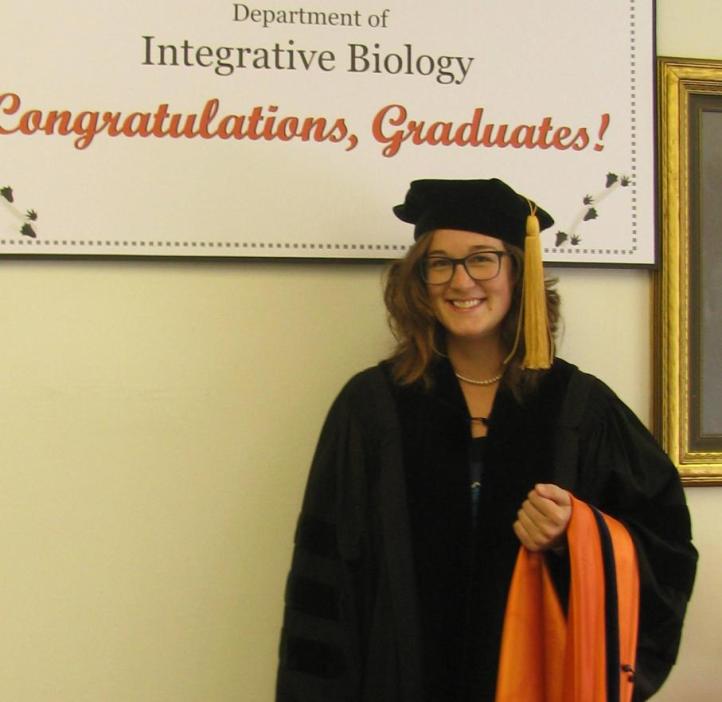 Hannah Tavalire (PhD Integrative Biology, 2017) wearing regalia that was donated to IB by the family of a 1960 PhD Zoology graduate.