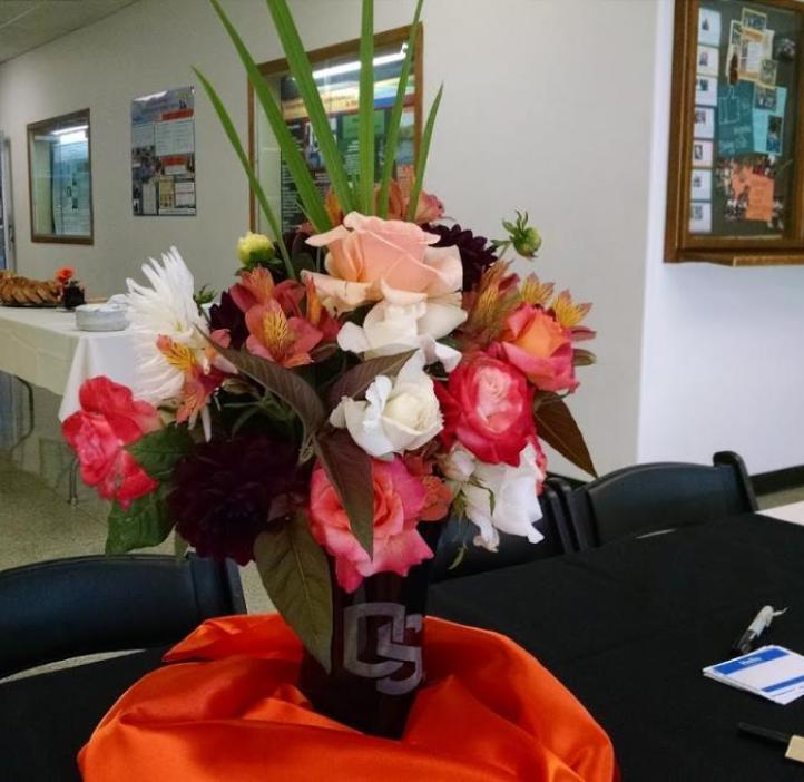 bouquet with an oregon state logo on a table