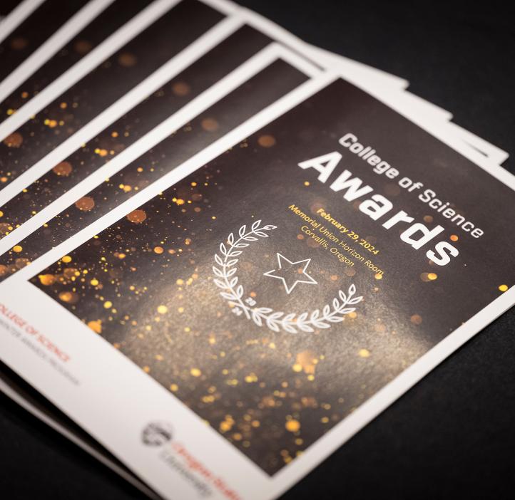 An array of the 2024 Winter College of Science Awards pamphlets lay out on the table at Oregon State University.